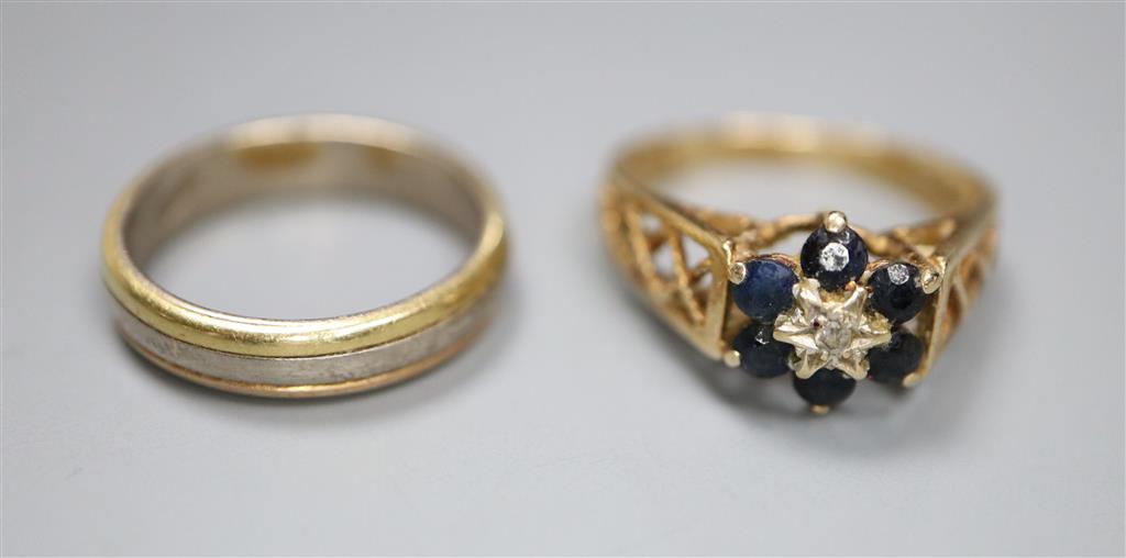 A Middle Eastern three colour metal ring and 9ct gold gem set ring, gross 2 grams.